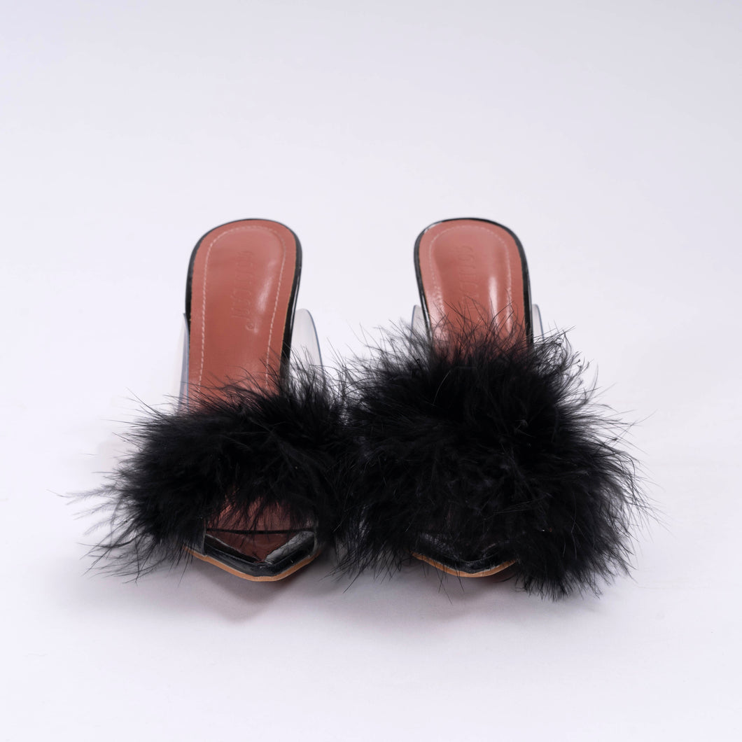 Front view of black faux feather clear kitten heels. Fuzzy bedroom short heeled house slippers.