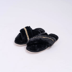 Fuzzy slipper slides in black. Jeweled house slippers. Birds eye view.