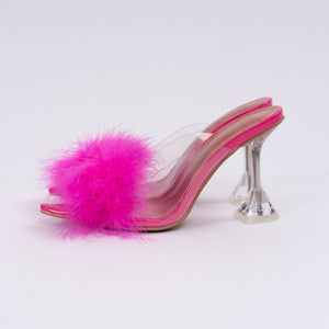 Side view of pink faux feather clear kitten heels. Fuzzy bedroom short heeled house slippers.